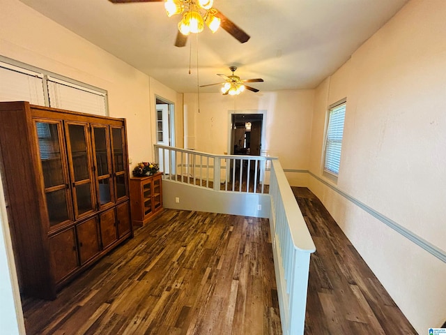 hall with dark wood-type flooring