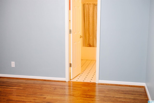 spare room featuring light hardwood / wood-style floors