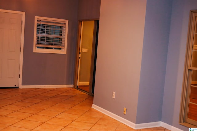 empty room with light tile patterned flooring