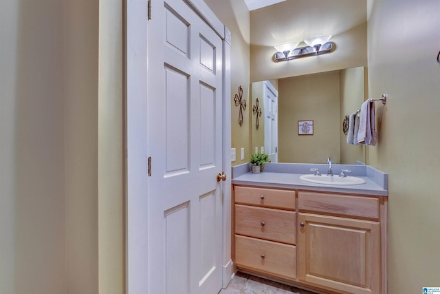 bathroom featuring tile floors and vanity