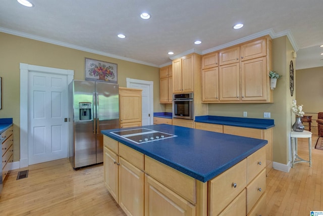 kitchen with stainless steel appliances, a center island, light hardwood / wood-style floors, and crown molding