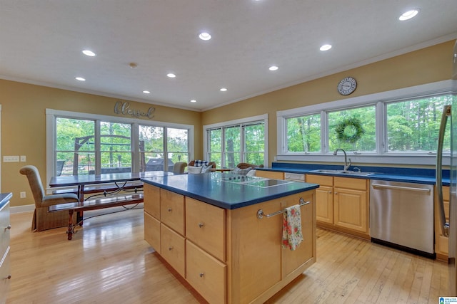 kitchen featuring a center island, sink, light hardwood / wood-style flooring, and stainless steel dishwasher