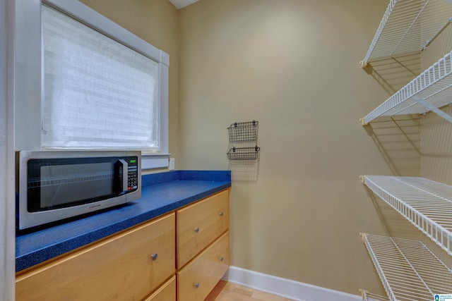 spacious closet featuring hardwood / wood-style flooring