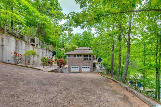 view of property exterior with a garage