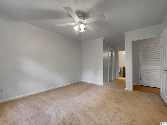 unfurnished bedroom featuring a closet, ceiling fan, and carpet floors