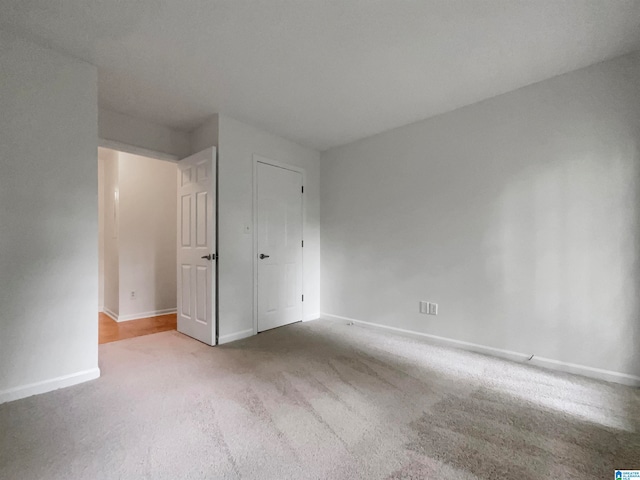 empty room featuring carpet flooring