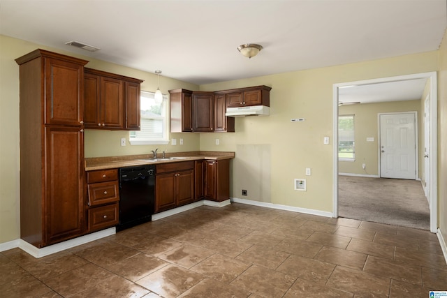 kitchen featuring tile flooring, sink, black dishwasher, and pendant lighting