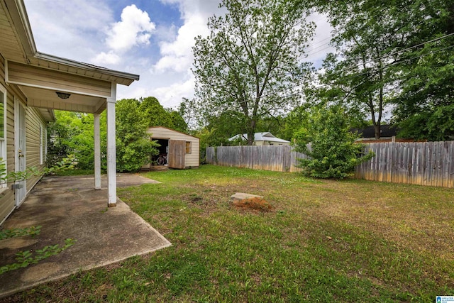 view of yard with a patio area and an outdoor structure