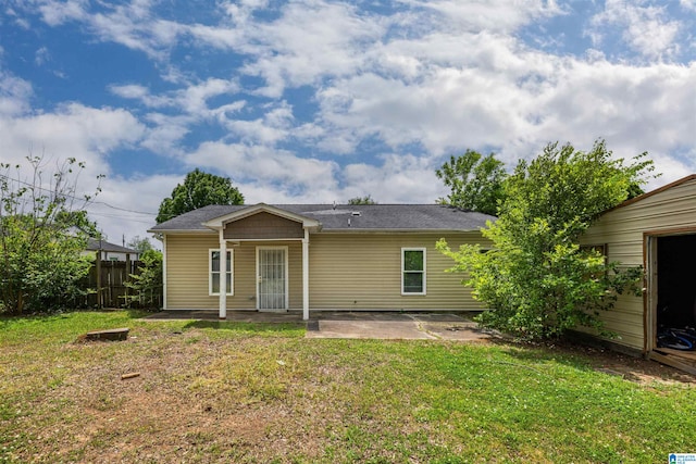 view of front of property with a front yard and a patio area