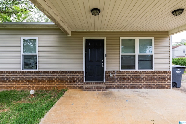 property entrance with a patio area