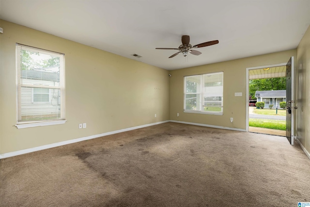 unfurnished room with ceiling fan and carpet floors