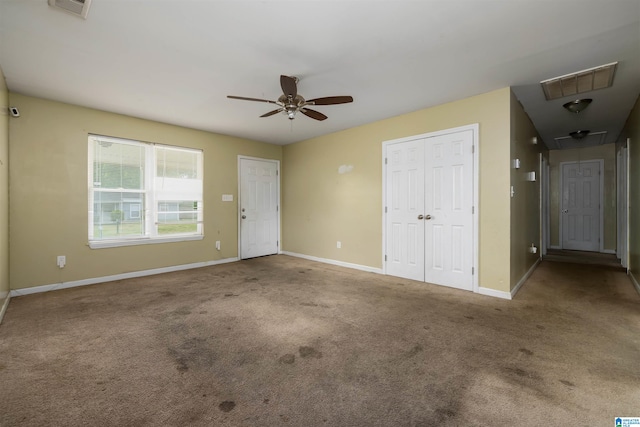 unfurnished bedroom featuring carpet and ceiling fan