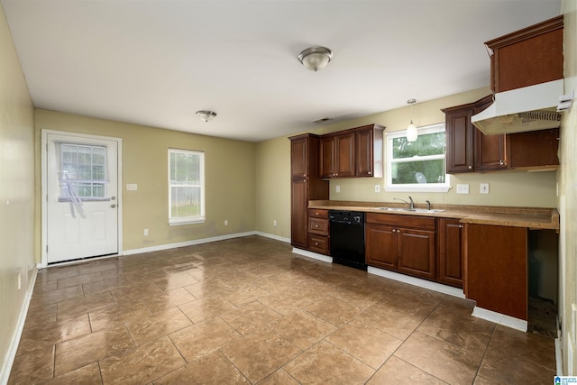 kitchen with tile flooring, plenty of natural light, pendant lighting, and black dishwasher