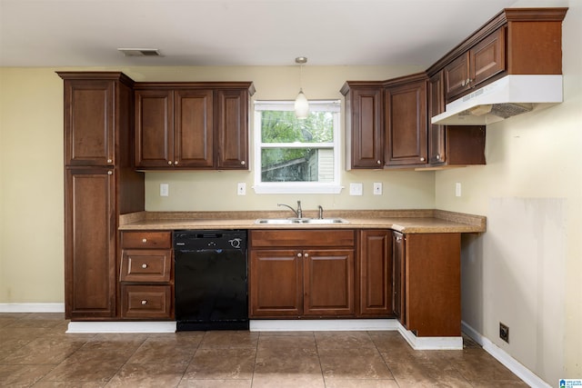 kitchen with sink, pendant lighting, dishwasher, and dark tile floors