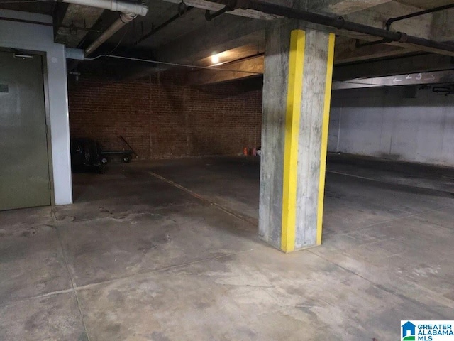 basement with brick wall