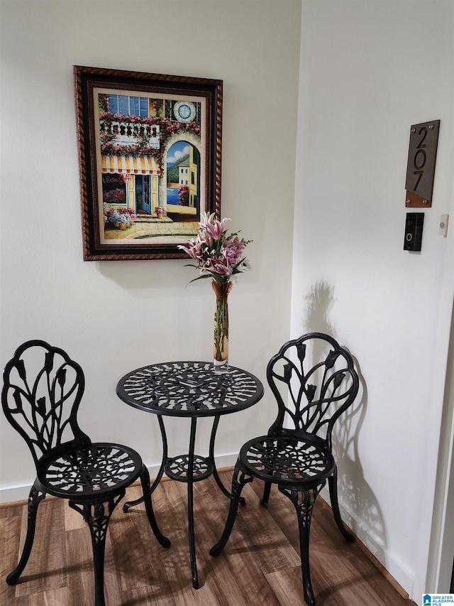 dining space featuring wood-type flooring