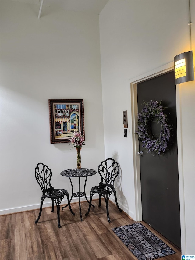 sitting room featuring dark wood-type flooring