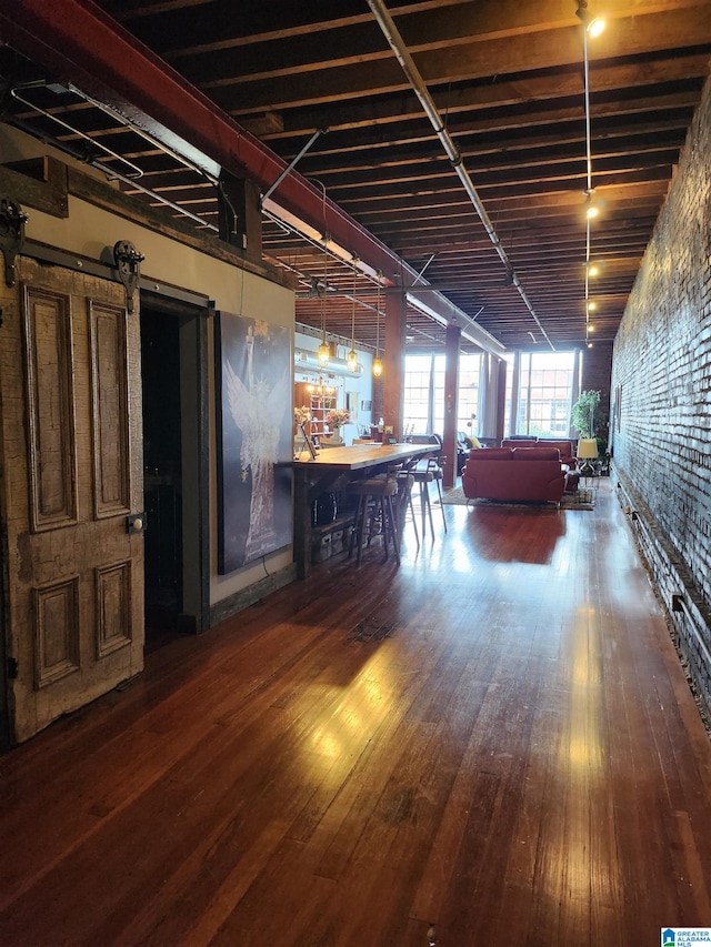 interior space with hardwood / wood-style floors and a barn door