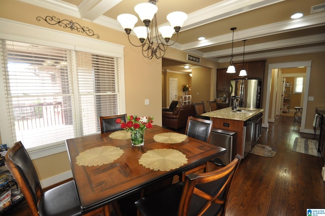 dining room with ornamental molding, a notable chandelier, beamed ceiling, and a wealth of natural light