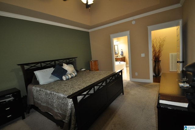 bedroom with carpet flooring, connected bathroom, ceiling fan, and crown molding