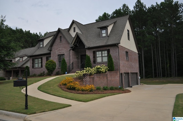 view of front facade with a garage and a front yard