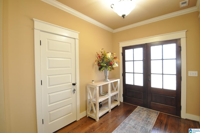 foyer entrance featuring ornamental molding, french doors, and dark wood-type flooring