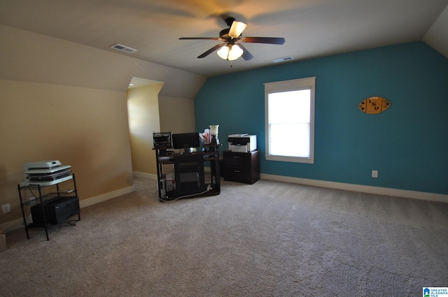 carpeted office space with vaulted ceiling and ceiling fan