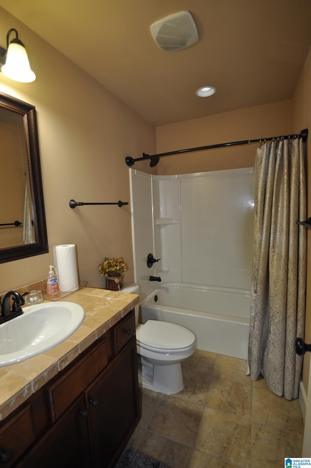 full bathroom featuring shower / tub combo, toilet, tile floors, and vanity