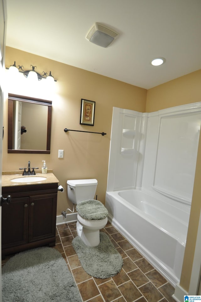 full bathroom with tile flooring, washtub / shower combination, oversized vanity, and toilet