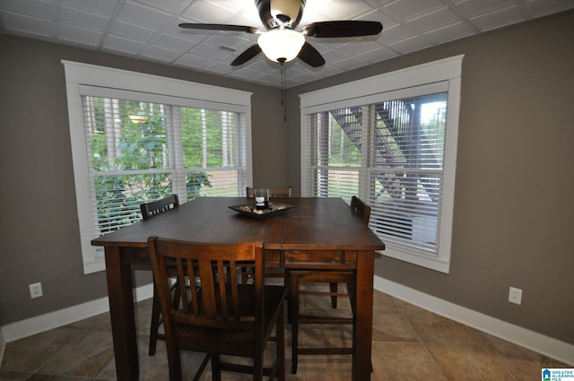 tiled dining room with ceiling fan