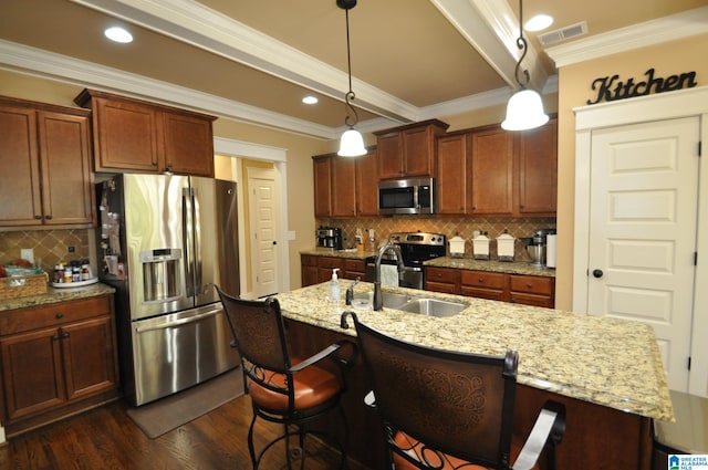 kitchen with dark hardwood / wood-style floors, tasteful backsplash, stainless steel appliances, and decorative light fixtures