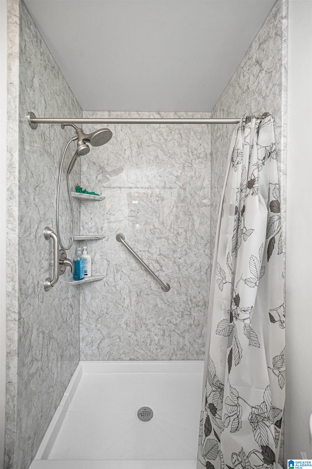 bathroom with a shower with curtain