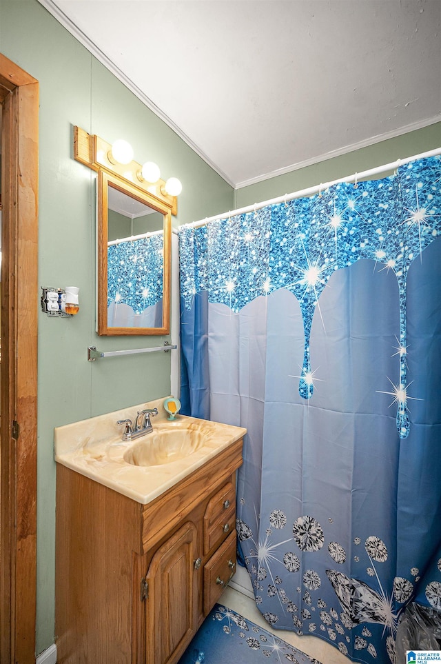 bathroom featuring ornamental molding and oversized vanity