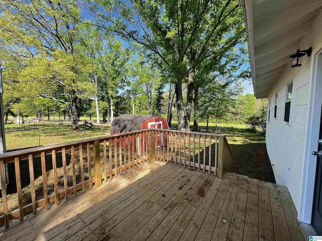deck with an outdoor structure and a shed
