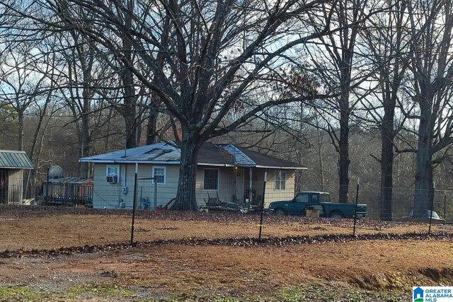 back of property featuring fence