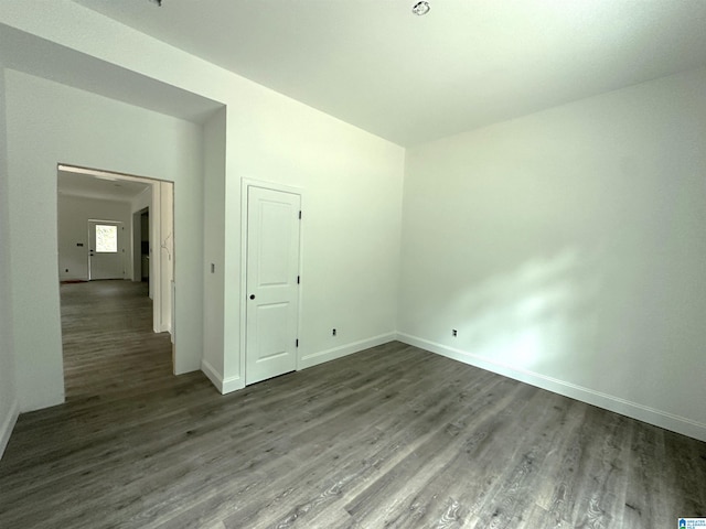 empty room with wood-type flooring