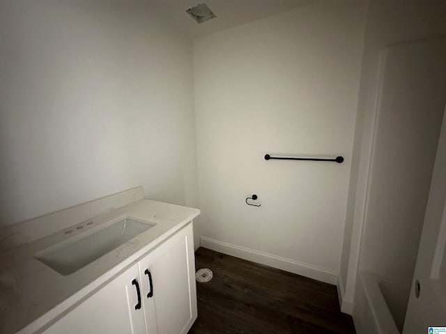 bathroom with hardwood / wood-style floors and vanity