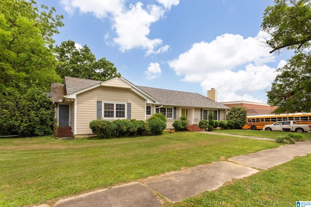 single story home with a front lawn