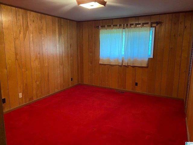 empty room featuring wooden walls