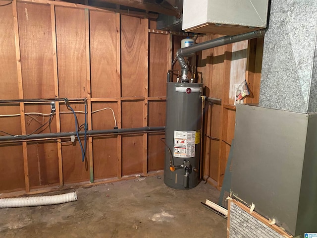 utility room featuring gas water heater and heating unit