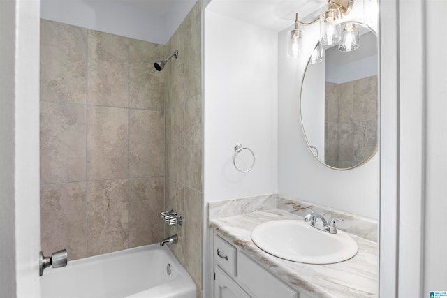 bathroom featuring vanity and tiled shower / bath combo