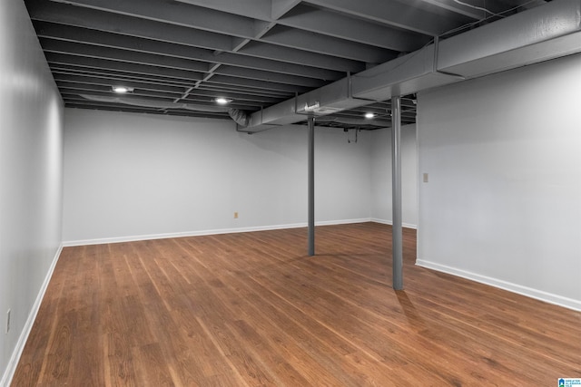 basement featuring hardwood / wood-style flooring