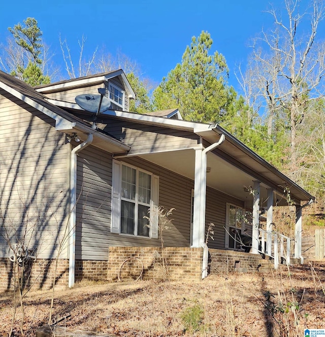 view of home's exterior featuring covered porch