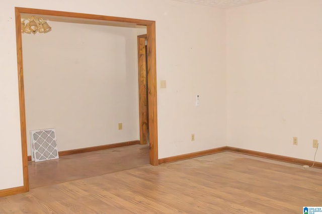 spare room featuring light hardwood / wood-style flooring