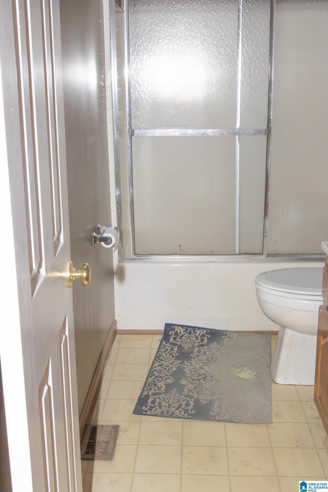 full bathroom with vanity, toilet, and combined bath / shower with glass door