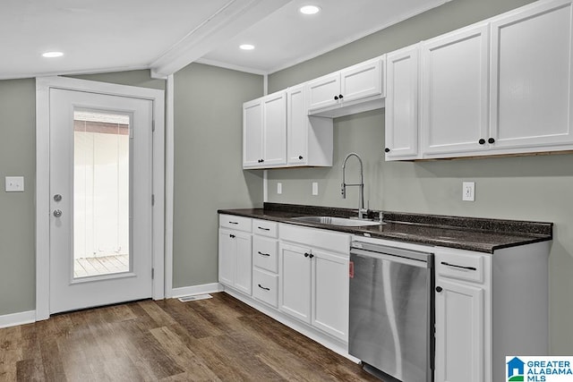 kitchen with white cabinets, dark hardwood / wood-style floors, sink, stainless steel dishwasher, and lofted ceiling