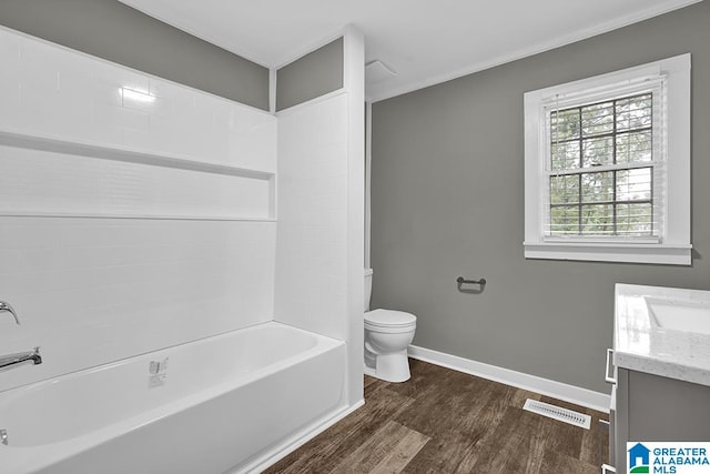 full bathroom featuring wood-type flooring, vanity, toilet, and shower / bathtub combination