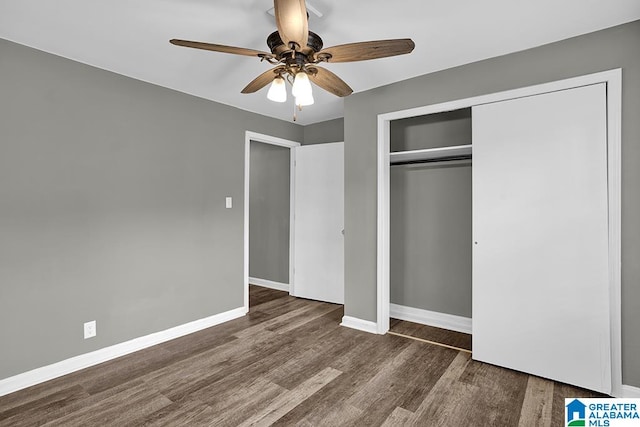 unfurnished bedroom featuring a closet, ceiling fan, and dark hardwood / wood-style flooring