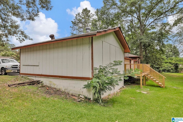 view of home's exterior with a lawn