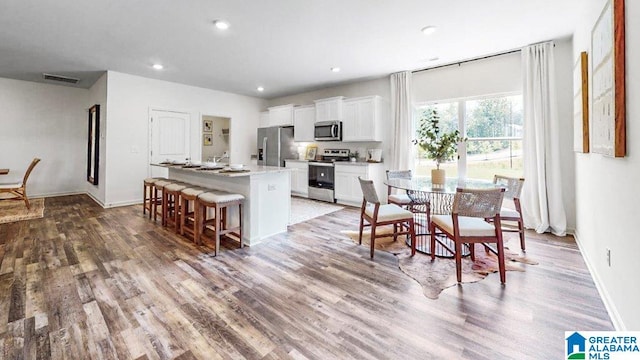 dining space featuring hardwood / wood-style flooring